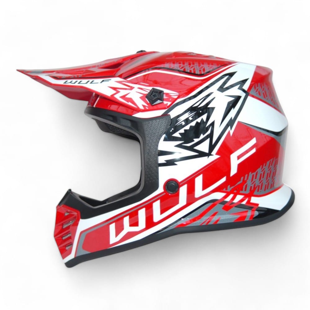 a red and white Wulfsport motorcycle helmet